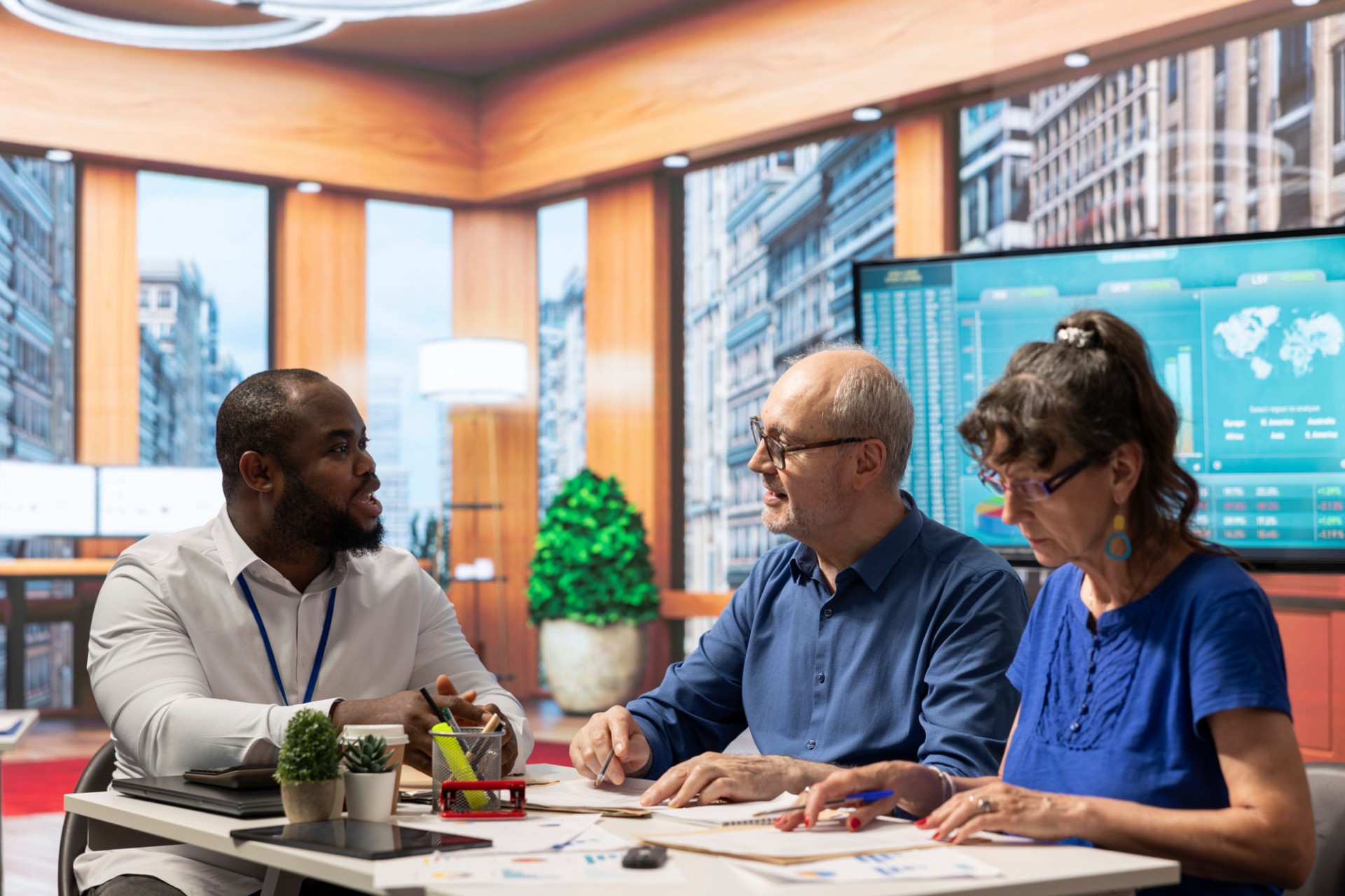 Senior citizens discussing retirement savings with a financial advisor